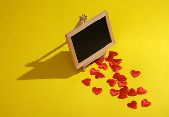 Chalk board with hearts on a yellow background. Valentine's day, love concept