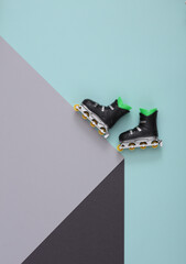 Roller skates on a paper cube. Optical illusion. Geometric composition. Sport concept. Minimalistic...