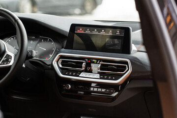 Digital car radio. Modern car radio in car. Smart multimedia touchscreen system..