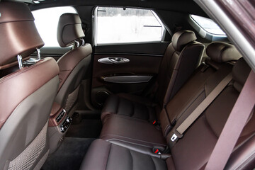 Modern SUV car inside. Leather light back passenger seats in modern luxury car. Comfortable leather seats.