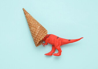 Tyrannosaurus rex with waffle cone on blue background