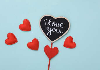 Stick with the word I love you and hearts on a blue background. Valentine's Day
