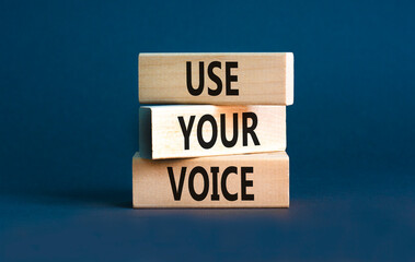 Use your voice symbol. Concept words Use your voice on wooden blocks on a beautiful grey table grey...