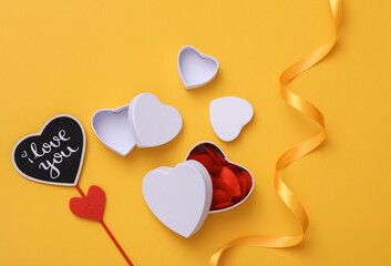 Flat lay composition valentines day background on yellow background