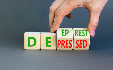 Depressed or deep rest symbol. Concept word Depressed or Deep rest on wooden cubes. Beautiful grey...