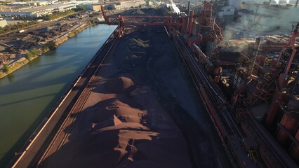 Steel manufacture factory urban area. Storage of iron ore, compound of iron, and other minerals...
