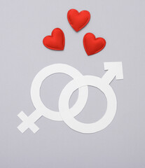 Hearts with gender female and male symbols on gray background. Love concept