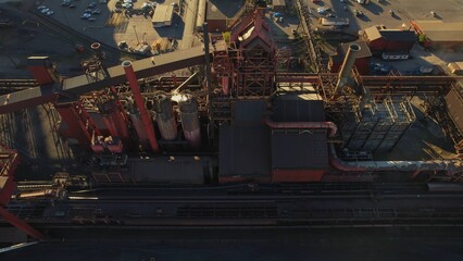 Steel factory aerial. Industry metallurgical plant at golden hour. Heavy industrial plant facility...