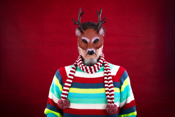man at christmas wearing deer mask