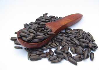 Sunflower seeds on a wooden spoon 