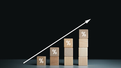 Interest rate financial and mortgage rates concept. Wooden blocks with Icon percentage symbol and...