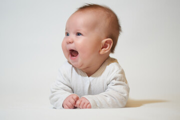 portrait of a smiling baby on a white background