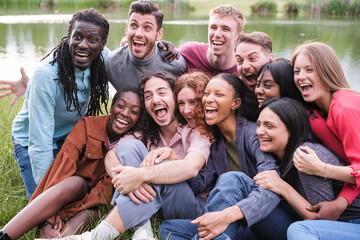 Fototapeta premium Group of friends from different cultures shouting and with funny faces having a joyful time