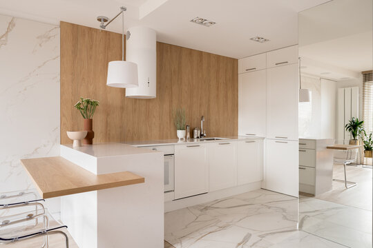Fashionable kitchen with aesthetic white cupboards