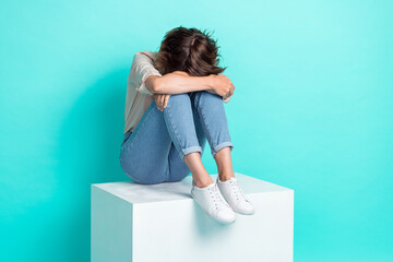 Full length photo of moody girlfriend sitting white cube hiding face crying lost boyfriend job empty space isolated cyan color background - obrazy, fototapety, plakaty