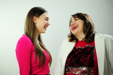 communication of mother and daughter 40 and 17 years old they are glad to each other friendship and...