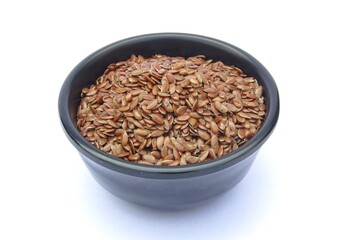 Flax seeds in a bowl isolated on white background 