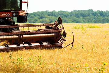 Modern tractor in the field with complex for the plowing. The concept of work in a fields and...