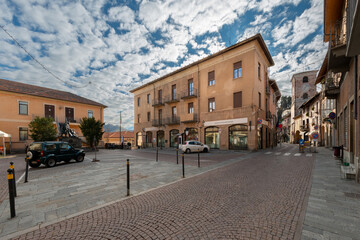 Borgo San Dalmazzo, Cuneo, Italy - December 01, 2022: Via Roma with Town Hall and Civic Tower, built in the 16th century in the city of the cold fair