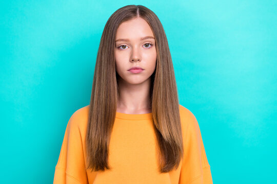 Closeup photo of young pretty attractive unhappy girl brown hair bored serious look you unsatisfied face isolated on aquamarine color background