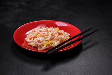 Delicious fresh rice noodles with shrimp, spices and herbs