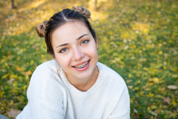 teenage girl with braces smiling