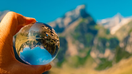 Crystal ball alpine summer landscape shot at the famous Seealpsee lake, Appenzell, Alpstein,...