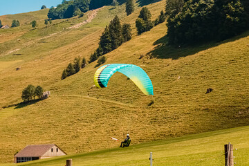 Beautiful alpine summer view with a paraglider at Wasserauen, Appenzell, Alpstein, Switzerland