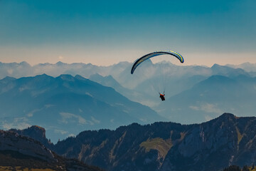 Beautiful alpine summer view with a paraglider at the famous Ebenalp, Appenzell, Alpstein, Switzerland