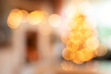 Living room with Christmas tree. Shiny bokeh due to blurring in the whole picture. Christmas background.