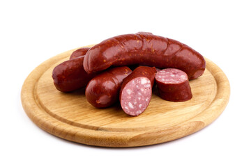Grilled pork sausages with lettuce, close-up, isolated on white background.