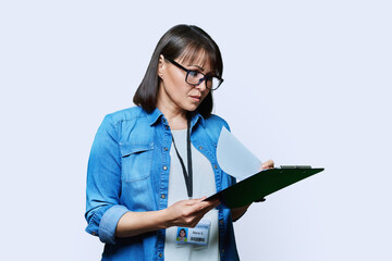 Portrait of woman worker with industrial center card clipboard, on white background