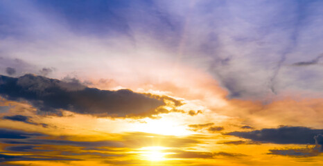 Sunset in the sky with clouds. Wide photo.