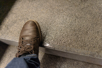 Wet and slippery street surfaces during and after rain. Danger of walking