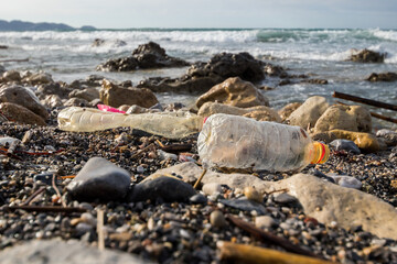Heraklion, Crete Island, Greece. April 19, 2021: Poluted beach with plastic empty bottles