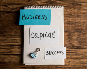 The inscription on the papers business capital success
