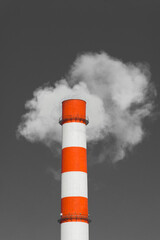 Pollution of the environment, ecology and air. Withdrawal of combustion products of soot, smoke and gases from the pipe of an industrial plant into the atmosphere against the background of a gray sky