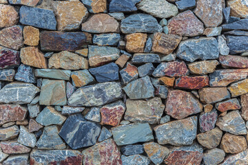 Natural colorful rust quarzite wall.