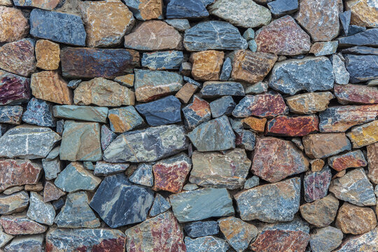 Natural colorful rust quarzite wall.