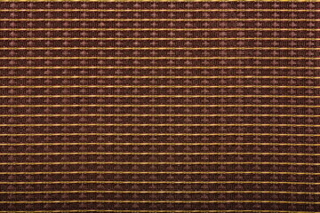 Detailed image of vintage speaker grill cloth on a 50s American guitar amplifier 