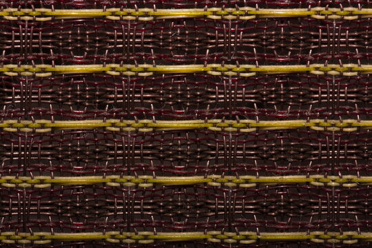 Closeup image of vintage speaker grill cloth on a 50s American guitar amplifier 
