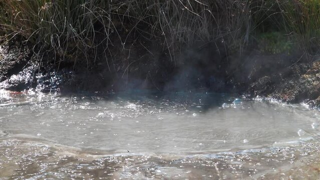 Semi-thermal area, geothermal fluid. Mineral hot springs is confined to post-volcanic phase, white ammonium chloride. Kamchatka