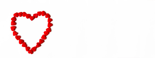 Banner of red hearts forms a heart shape on a white background. Isolated heart shape. The concept of love and romance. Romantic background composition. Valentine's Day