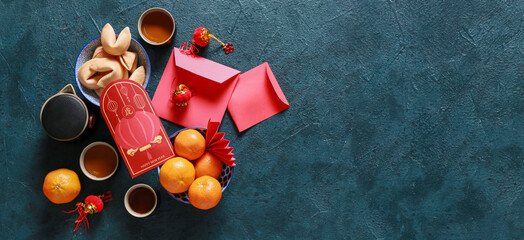 Red envelopes with Chinese symbols on dark background with space for text