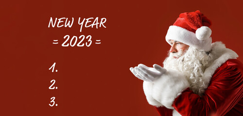 Santa Claus and blank to-do list for year 2023 on red background