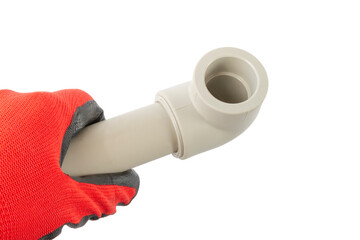 soldered corner to the pvc pipe in the hand of the master, on an isolated