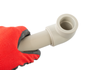 soldered corner to the pvc pipe in the hand of the master, on an isolated