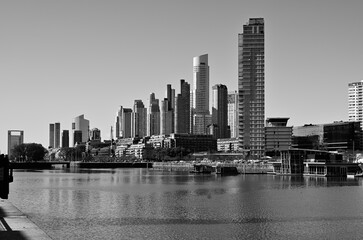 Modern buildings in Puerto Madero next to the river almost in the form of a graphic asendete
