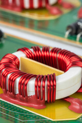 Electronic components electromagnetic coil inductor on circuit board close-up