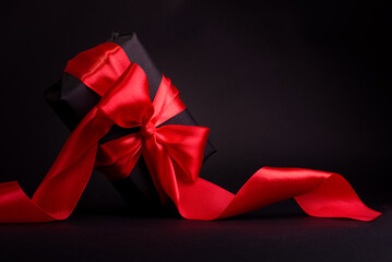 Black Friday Shopping Concept with Black gift box with red ribbon. Boxing day promo banner with copy space.